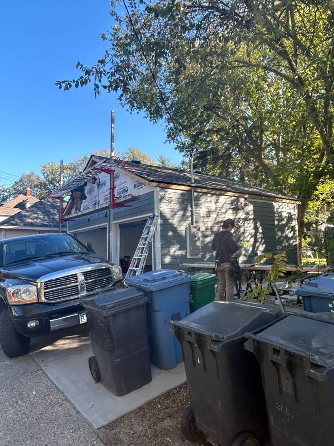 Installing siding on a two door car garage